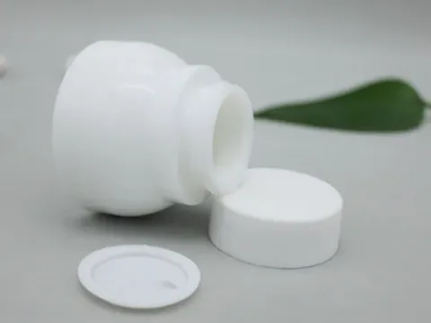 White Round Glass Skincare Containers with Lids — view 2