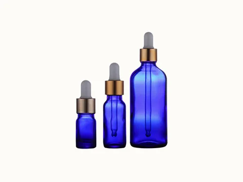 Blue Cylindrical Glass Essential Oil Bottle
